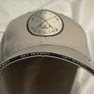 White cap with mountain logo and 'Go Beyond' text on the visor edge.